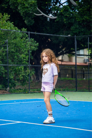Purple girls cotton knit shorts  by Little Baddie, trendy boutique fashion for tween girls aged 6 to 12, girl playing tennis