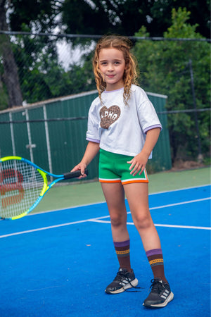 Girls cotton knit shorts in green by Little Baddie with premium textured finish, stylish boutique shorts for girls aged 5 to 12, girl playing tennis