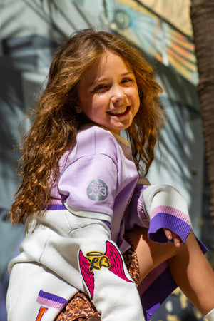 Purple girls knit cardigan with relaxed fit by Little Baddie, trendy boutique layering piece for tween girls aged 5 to 12 , styled, Girls heart graphic cropped tee by Little Baddie, trendy casual t-shirt for stylish girls aged 5 to 12