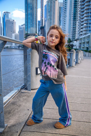 Girls wide leg pants in blue jeans by Little Baddie with sporty side tape detail, trendy streetwear style for girls aged 5 to 12
