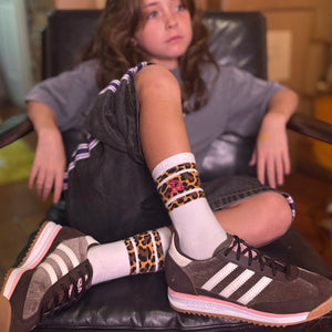 White crew socks with leopard stripe cuff and pink LB embroidery
